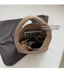 Top view of gold woven hobo bag interior showing spacious capacity for tablets and daily items
