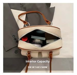 Detailed interior of a beige woven pillow bag showing spacious storage and silver hardware