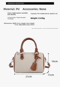 Detailed view of bicolor Boston bag dimensions 21x14x11cm with adjustable strap