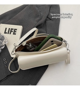 Interior view showing large capacity for phone and wallet in off-white crossbody bag