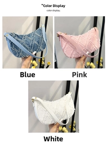 Detail display of denim underarm bags in blue, pink, and white with frayed edges