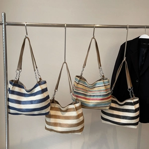 Colorful striped woven straw tote bag with leather chain shoulder straps for beach