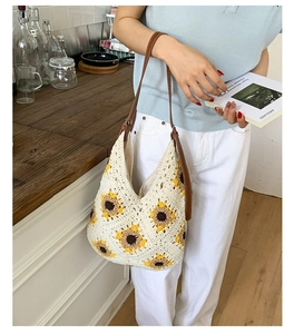 Detail of sunflower crochet tote bag showing handmade knit pattern and leather strap