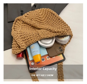 Detail shot of woven straw tote bag interior showing large capacity and daily essentials
