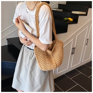 Khaki woven cotton rope tote bag showing its large capacity and texture on a model