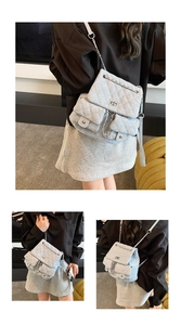 Close-up of quilted denim backpack with chain straps and silver twist lock detail