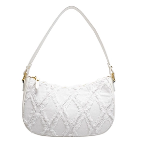 White crescent baguette shoulder bag with fringed denim texture and gold hardware