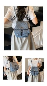 Detailed view of light blue quilted denim backpack with chain straps and dual front pockets