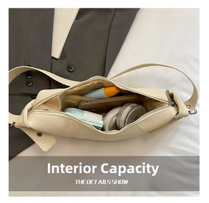 Spacious interior of beige lychee leather half moon bag with daily essentials inside