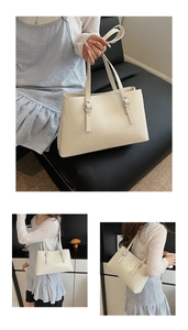 Detail of cream white tote bag showing polished PU leather texture and silver buckle accents