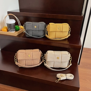 Woven crossbody bags in four colors with gold flower buckles and chain straps
