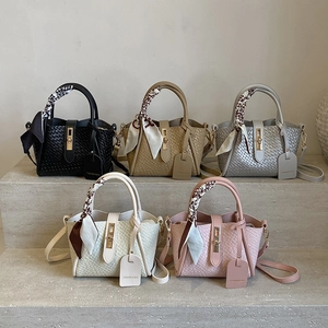 Chic woven bucket bag with metal clasp and scarf handle in five trendy colors