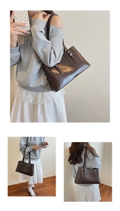 Detail view of large dark brown patent leather tote bag with glossy finish and silver hardware