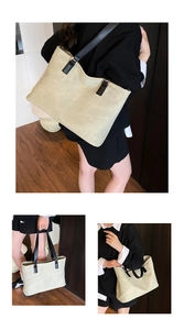 Three-way view of a large cream canvas tote bag with black handles on a female model