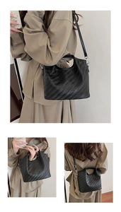 Three-way view of a black woven leather tote showing handbag, shoulder, and crossbody styles