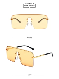 Vue détaillée de lunettes de soleil carrées sans monture avec cadre doré et verres orange