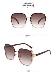 Detail of gold metal sunglasses frame featuring unique hollow geometric pattern on temples