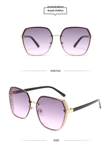 Detail of hollow-out metal frame and gradient purple lenses on oversized sunglasses