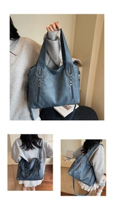 Detail of Morandi blue tote bag featuring smooth leather texture and dual vertical zippers