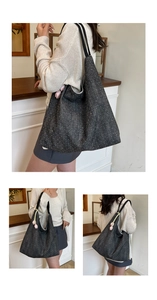 Close-up of dark grey sequin tote bag with pink tulip charm and black double straps