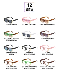 Matrix of twelve cat eye sunglasses in various frame colors with gold triangle accents