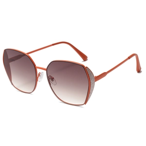 Fashionable oversized metal sunglasses with orange frames and gradient brown lenses
