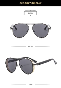 Detail view of aviator sunglasses with black frame and decorative metal hinge accents