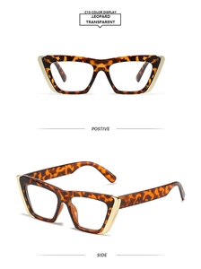 Detail view of leopard cat-eye glasses frame with golden metal accents and clear lenses