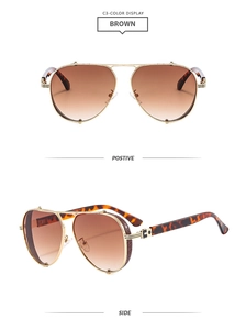 Detailed view of gold metal aviator sunglasses with brown gradient lenses and tortoise temples