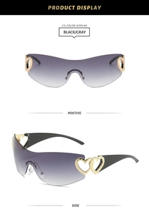 Detail of Y2K rimless sunglasses featuring golden heart metal engraving on gradient lenses