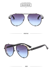 Detail view of aviator sunglasses with gold hollow carving on temples and blue gradient lenses