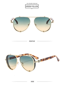 Detail of gold aviator sunglasses with green-yellow gradient lenses and tortoise temples