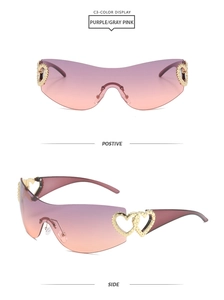 Detail of Y2K rimless sunglasses with gradient lenses and golden heart hinge accents
