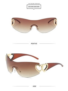 Detail view of brown frameless heart sunglasses with golden cutout temple metal accent