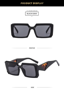 Detail of square black sunglasses featuring unique orange leopard triangle on the temple