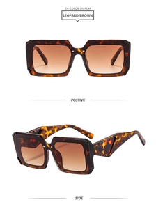 Detail view of square tortoiseshell sunglasses with brown lenses and hollow triangle temple