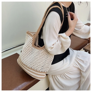Detailed close-up of handmade hollow crochet knit tote bag showing woven mesh texture