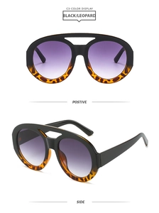 Detail view showing black and leopard print frame with purple gradient lenses