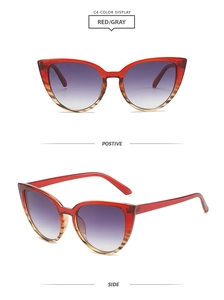 Detail view of red cat-eye sunglasses with gradient lenses in front and side perspectives