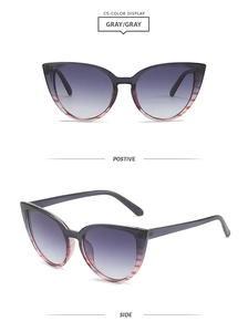 Cat-eye sunglasses with gray gradient lenses and red-white striped frame accents