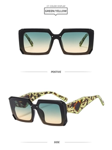 Detail of square sunglasses with green-yellow gradient lenses and leopard print temples