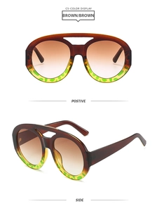 Detail view of large oval aviator sunglasses with brown gradient lenses and leopard frame