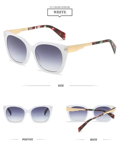 Detail view of square white translucent sunglasses with gold and floral metal temples