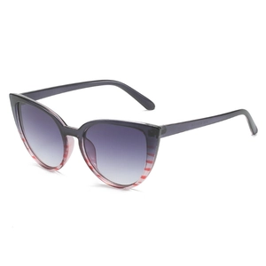 Modern cat-eye sunglasses with two-tone frame and gradient grey lenses on white background