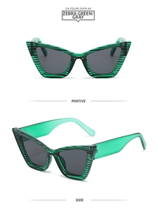 Detail view of cat eye sunglasses featuring zebra green frames and gray lenses