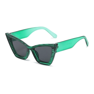 Chic green cat eye sunglasses with textured frames and dark grey lenses in a 45-degree view