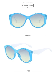 Detail of geometric blue and white sunglasses with blue-yellow gradient lenses