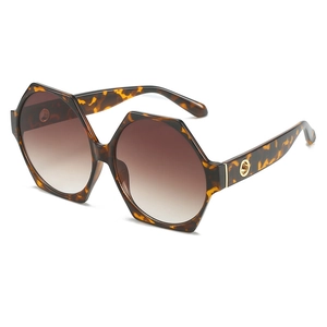 Fashionable hexagonal oversized tortoise shell sunglasses with gradient lenses and gold detail
