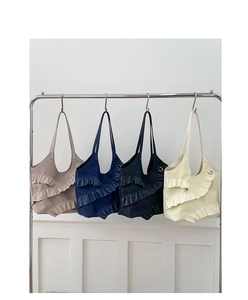 Detail view of tiered ruffle lace tote bags in four colors for summer fashion