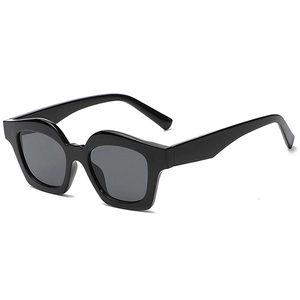 Bold black square frame sunglasses with dark lenses in a retro minimalist style